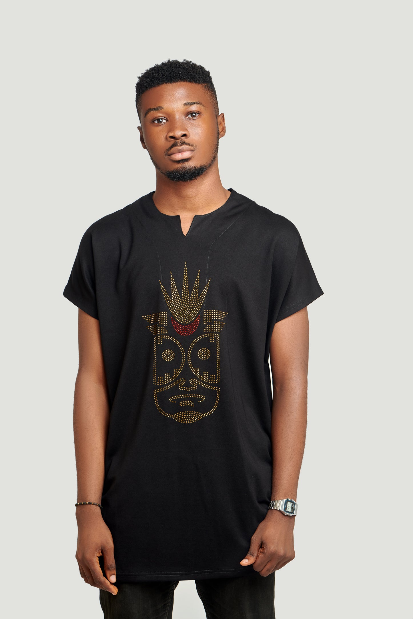 The Curban dropneck piece is a capsleeve top with a v neck cut for the neckline featuring rhinestone Afrocentric image in front. Perfect menswear outfit for an outing.